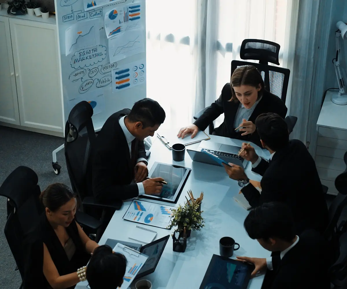 top-view-skilled-businesspeople-working-together-meeting-directorate 1 (1)